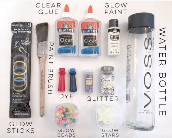 A package of glow sticks, a brush, glow beads and stars, and bottles of glue, glitter, food coloring, and glow pain next to an empty water bottle.