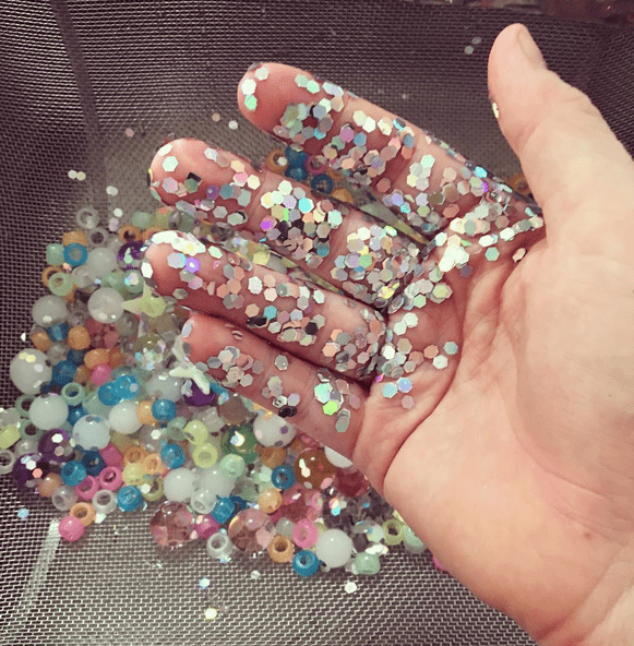 My hand covered with glitter