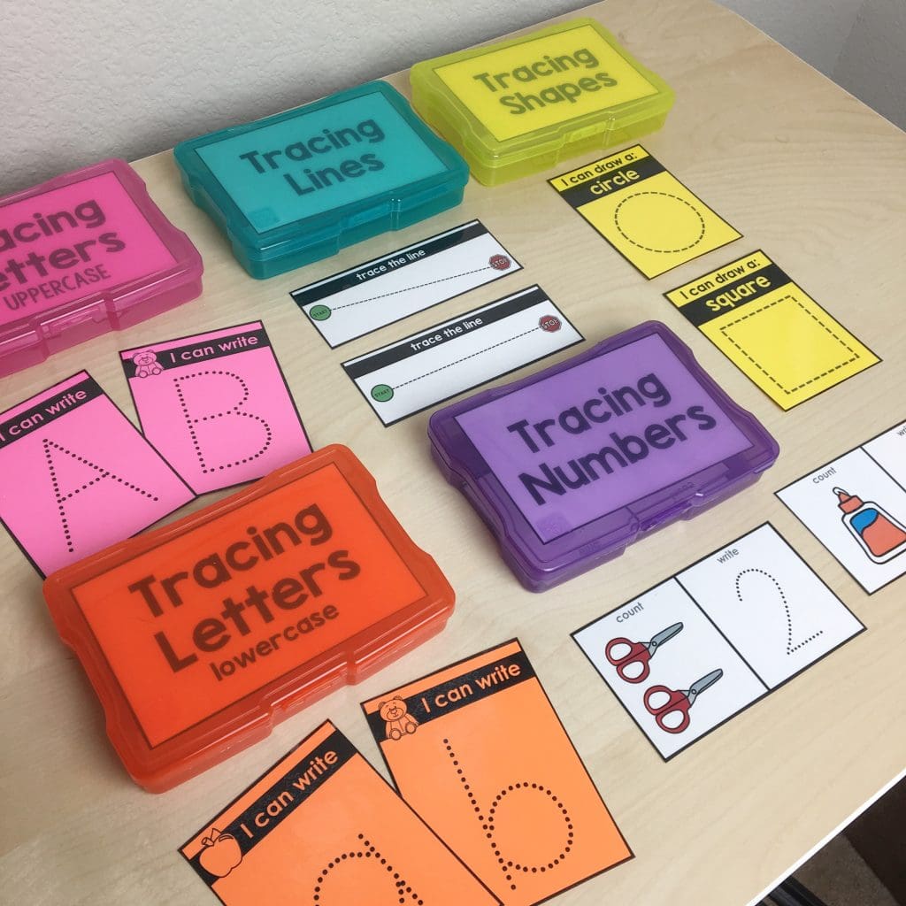 Colorful clear boxes holding task box materials for tracing shapes, letters, numbers and lines