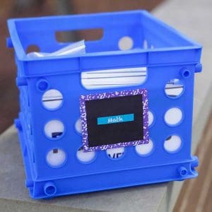 Blue storage box holds bags of activities for task boxes