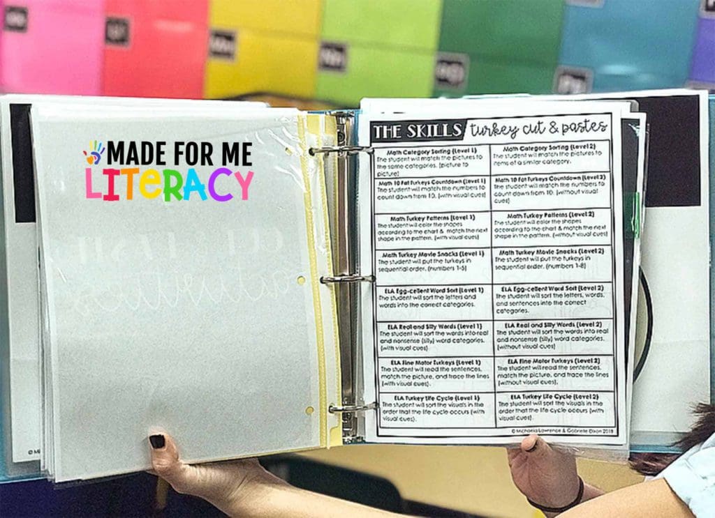 Elementary teacher holding a notebook with her Made For Me Literacy teaching resources