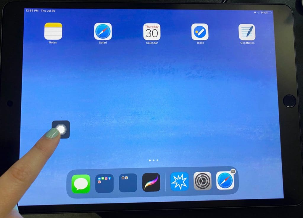 An iPad screen with the Assistive Touch capable of using the finger pointer tip for distance learning