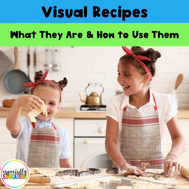 Two young girls, in matching aprons are cooking at the kitchen counter. They appear to be cutting out cookie shapes and placing them on a baking sheet both are slightly messy and smiling.