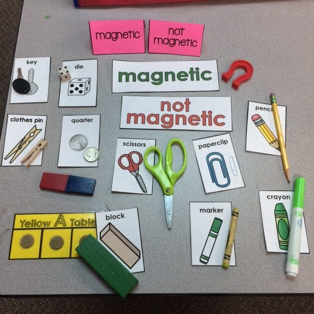 A variety of Especially Education Magnetic Science lesson flash cards, showing items that may or may not be magnetic. The cards are accompanied by the items themselves to children can match the card and image and then place them under magnetic or not magnetic.