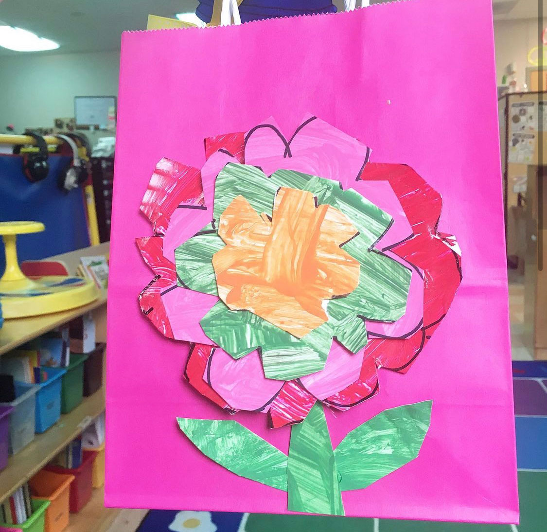 Layered flower craft for Mother’s Day using painted cutouts in a special education classroom