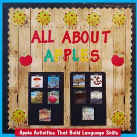 A bulletin board in a preschool classroom with apple vocabulary labeled parts of an apple, including stem, leaf, skin, seeds, core.