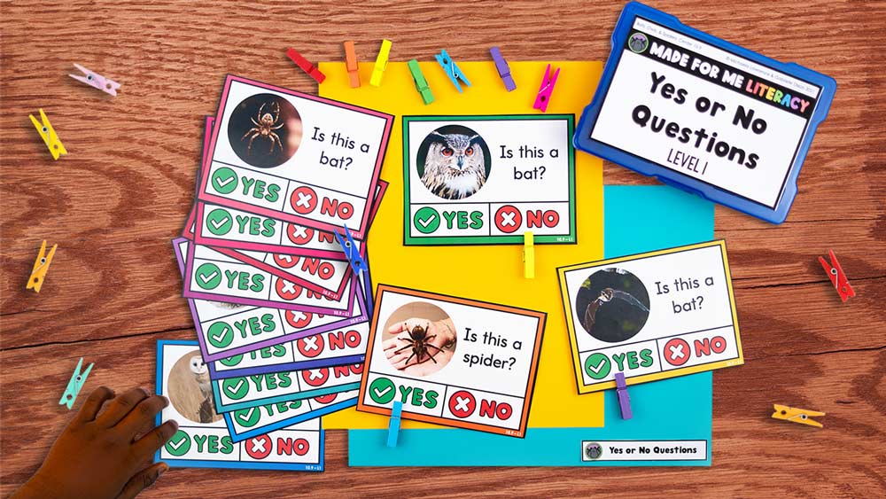 Made For Me Literacy task box with yes-or-no question cards show bats, owls, and spiders, with colorful clothespins used to mark answers.